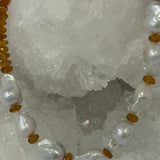Close-up of luminous natural baroque pearls separated by deep golden faceted citrine rondelles in the Golden Velvet necklace.