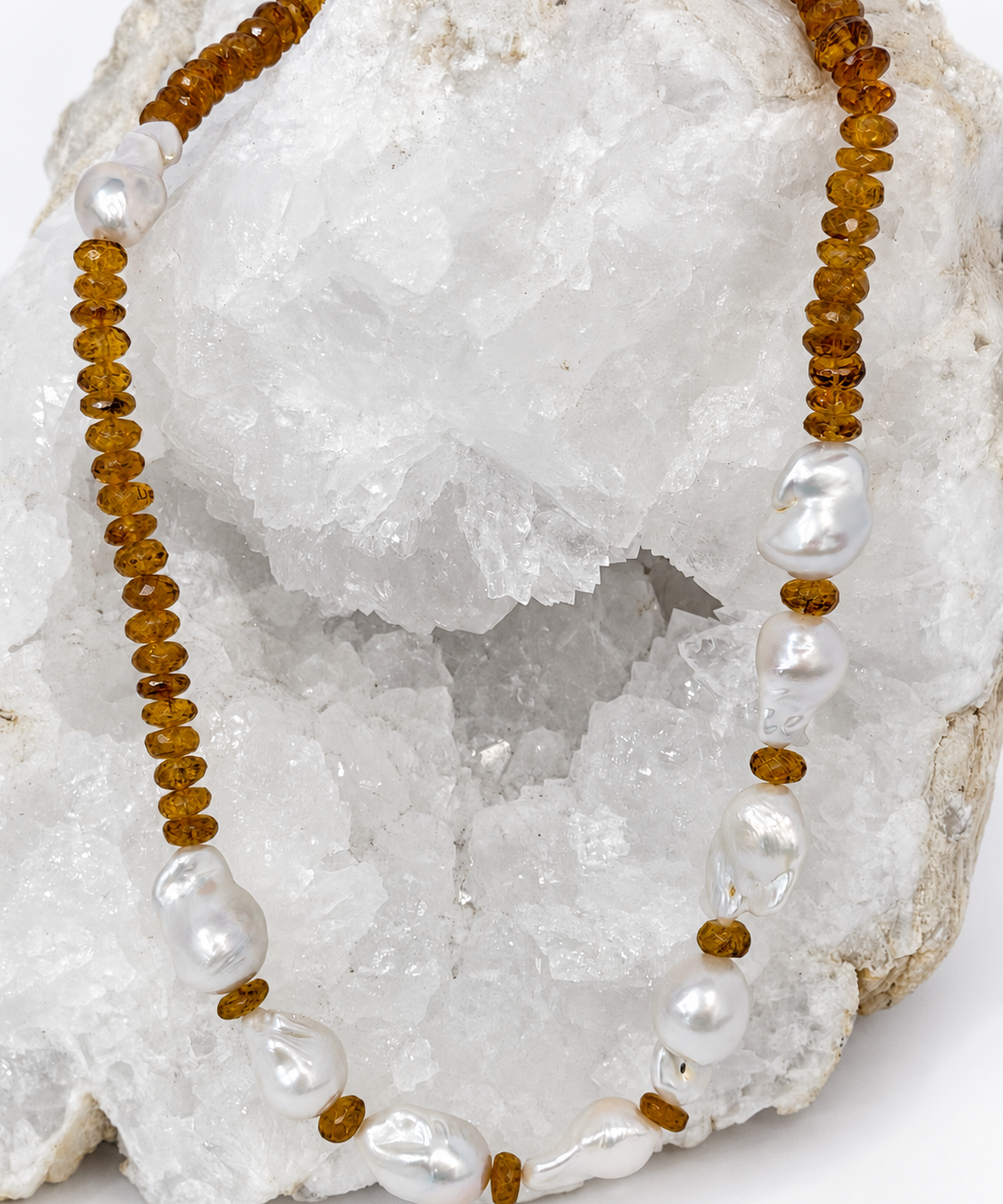 Golden Velvet necklace featuring deep golden citrine rondelles and a concentrated arrangement of natural baroque pearls on the front.