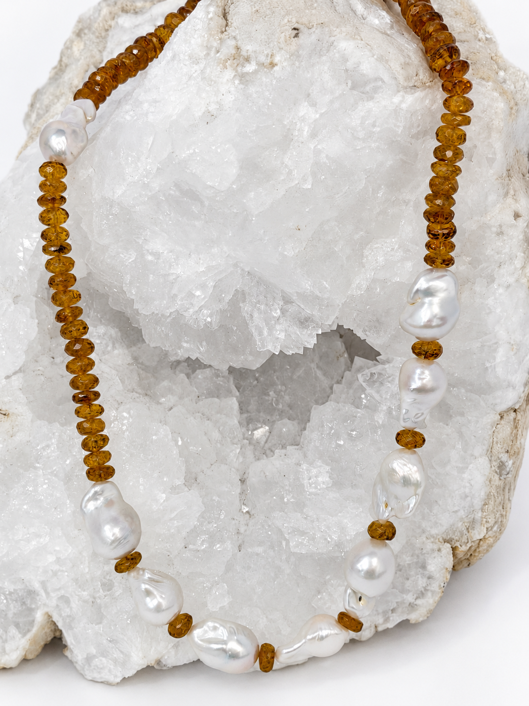 Golden Velvet necklace featuring deep golden citrine rondelles and a concentrated arrangement of natural baroque pearls on the front.
