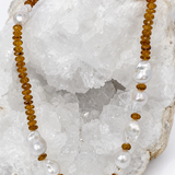 Golden Velvet necklace featuring deep golden citrine rondelles and a concentrated arrangement of natural baroque pearls on the front.