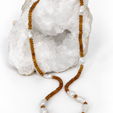 Golden Velvet 33-inch necklace with deep golden natural citrine rondelles and luminous white baroque pearls arranged throughout the long strand.