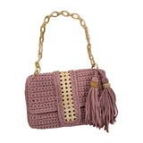 Blush hand-crocheted Camille clutch with natural fiber rattan center panel, gold-tone accent, and tassel