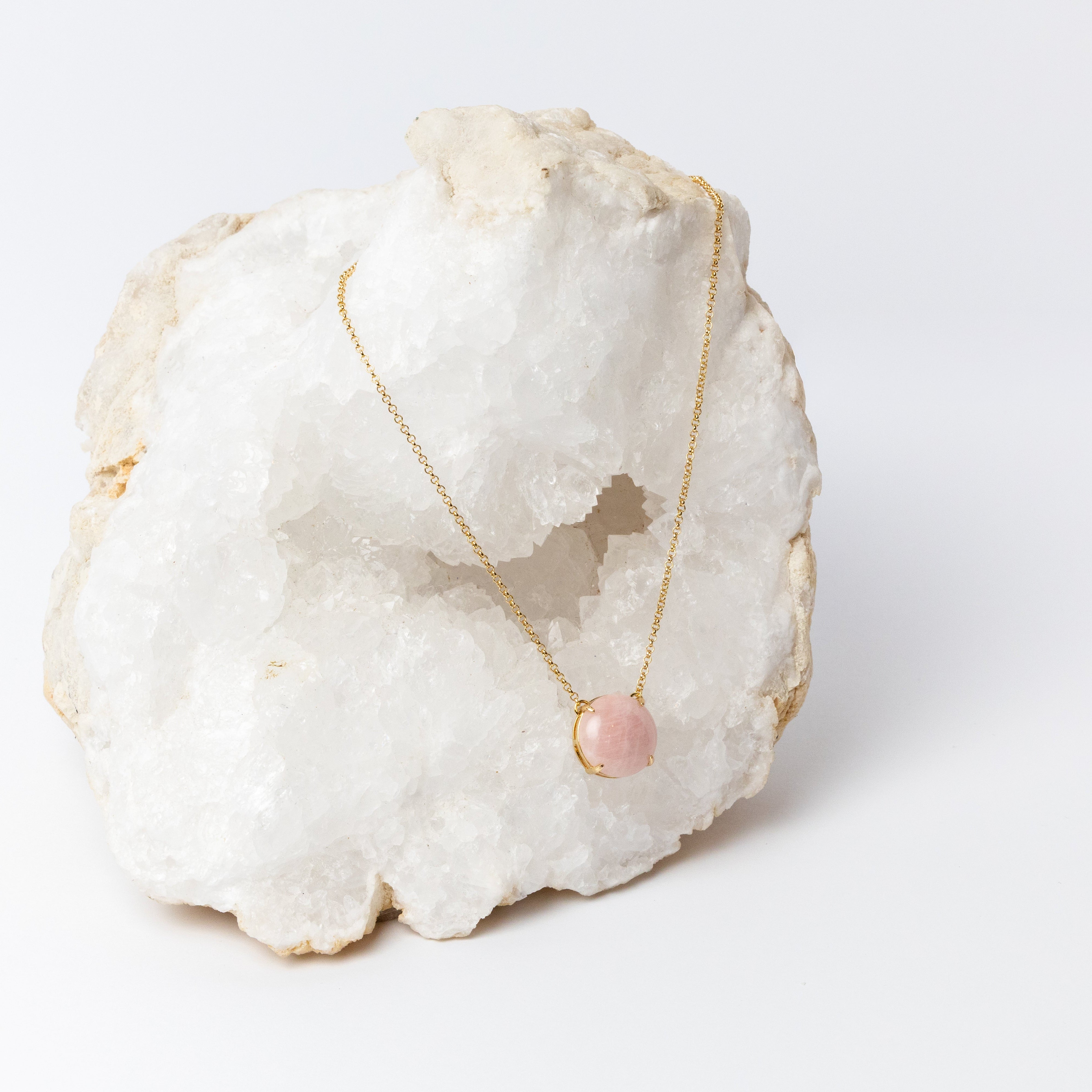 Luna Necklace featuring a luminous 20mm round rose quartz cabochon in a delicate gold-plated setting, suspended from a fine 18k gold-plated chain.