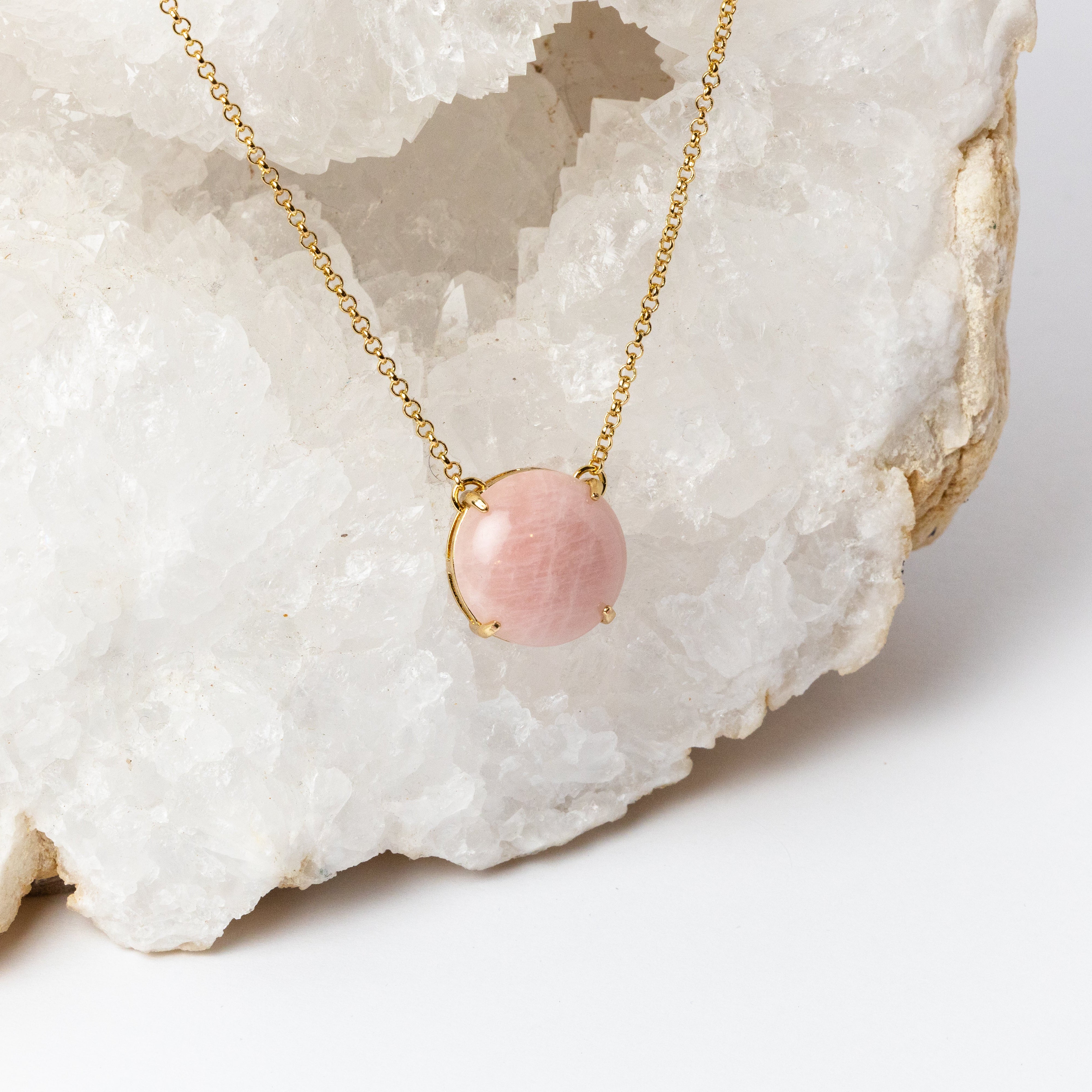 Close-up of Luna Necklace highlighting the luminous 20mm round rose quartz cabochon, its soft blush pink tones, and the delicate gold-plated setting.