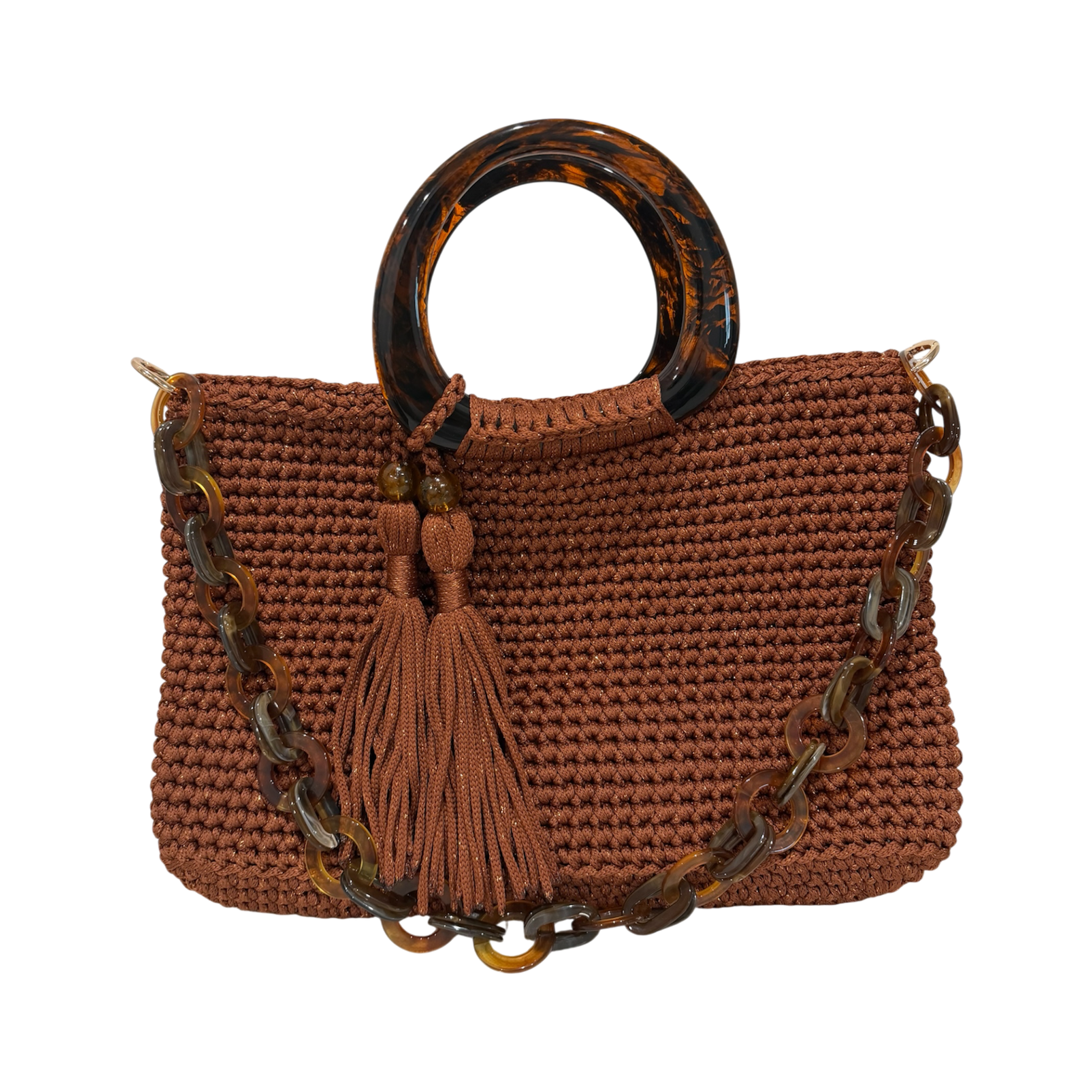 Copper hand-crocheted Monique handbag featuring a rounded marbled resin handle, coordinating resin-link chain, and twin tassel details.