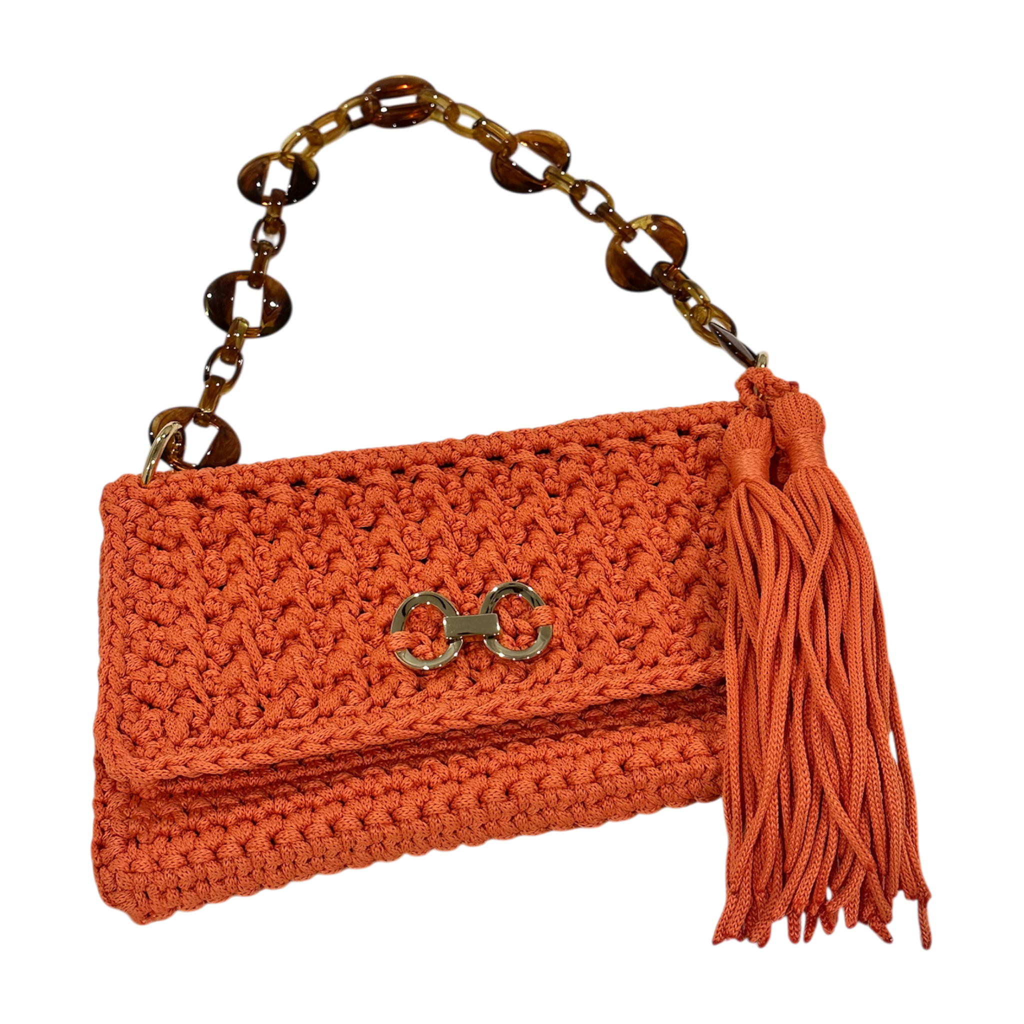 Orange hand-crocheted Polly clutch with gold-tone front detail, tassel, and resin chain