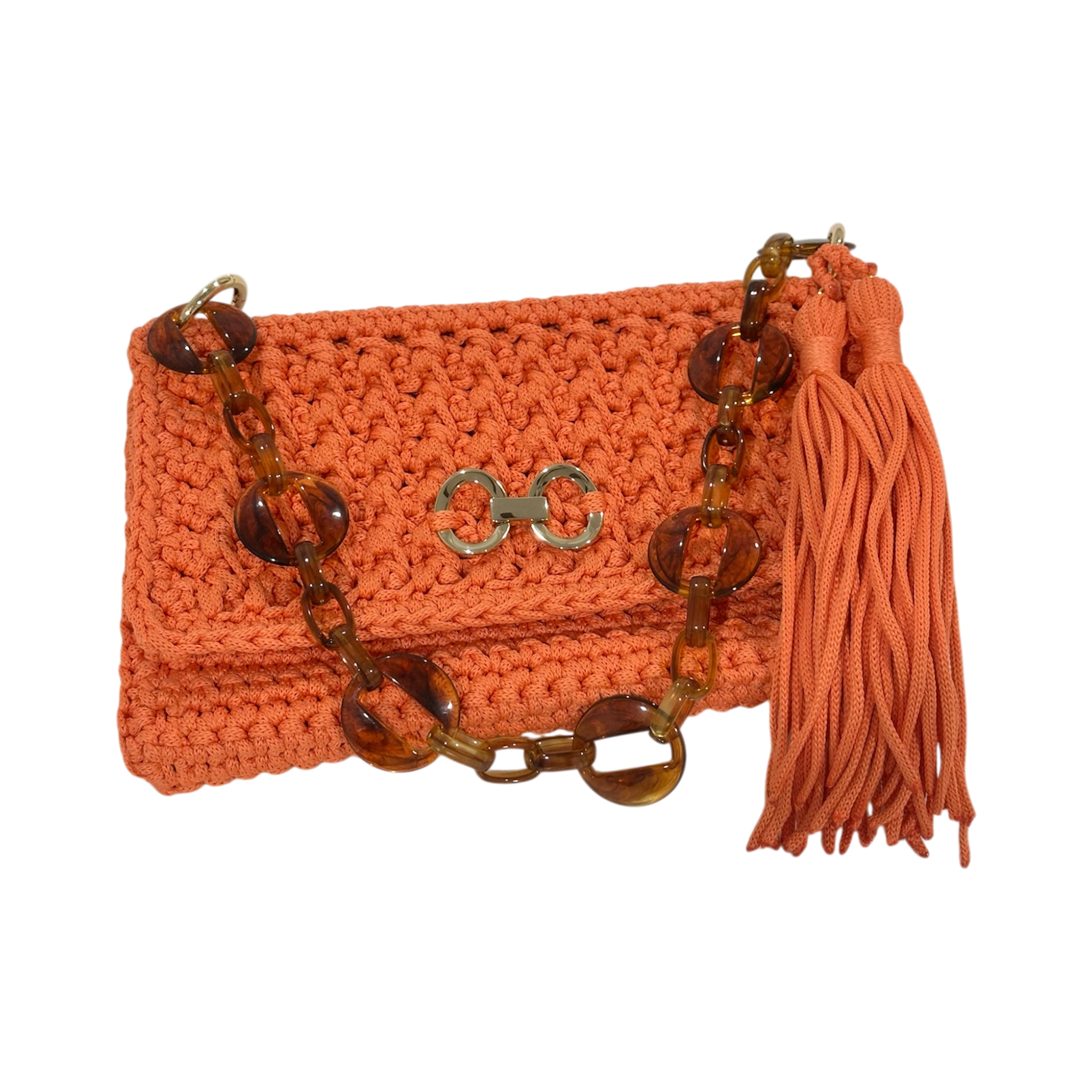 Close-up of crochet texture, gold-tone detail, and tassel on orange unique Polly clutch