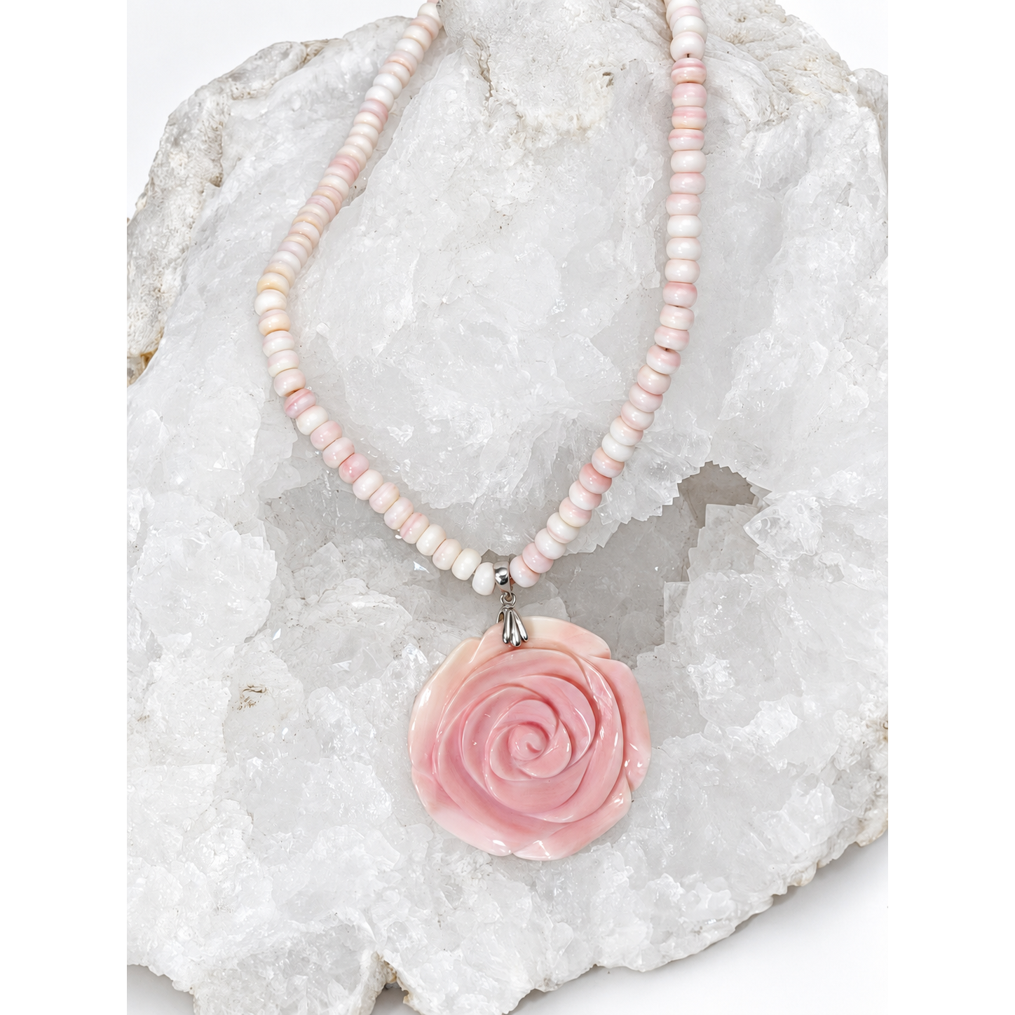 Handcrafted natural conch shell necklace with blush ivory and pink rondelles and a 4.5 cm hand-carved conch shell rose centerpiece, 18 inches with a 2-inch extension.