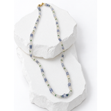  49-carat natural multicolor sapphire and emerald necklace featuring luminous pale blue, clear and soft green gemstones with a 14K gold clasp.