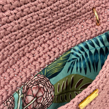 Interior of Camille Clutch with vibrant botanical floral lining in pink, green, and blue tones and secure closure