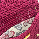 Botanical floral lining inside the Polly Clutch Mulberry Reserve featuring vibrant botanical motifs, magnetic closure, and handcrafted crochet construction
