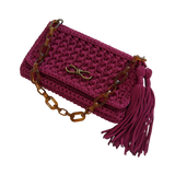 Polly Clutch Mulberry Reserve showcasing the resin chain, bronze hardware, decorative front accent, and textured hand-crocheted finish