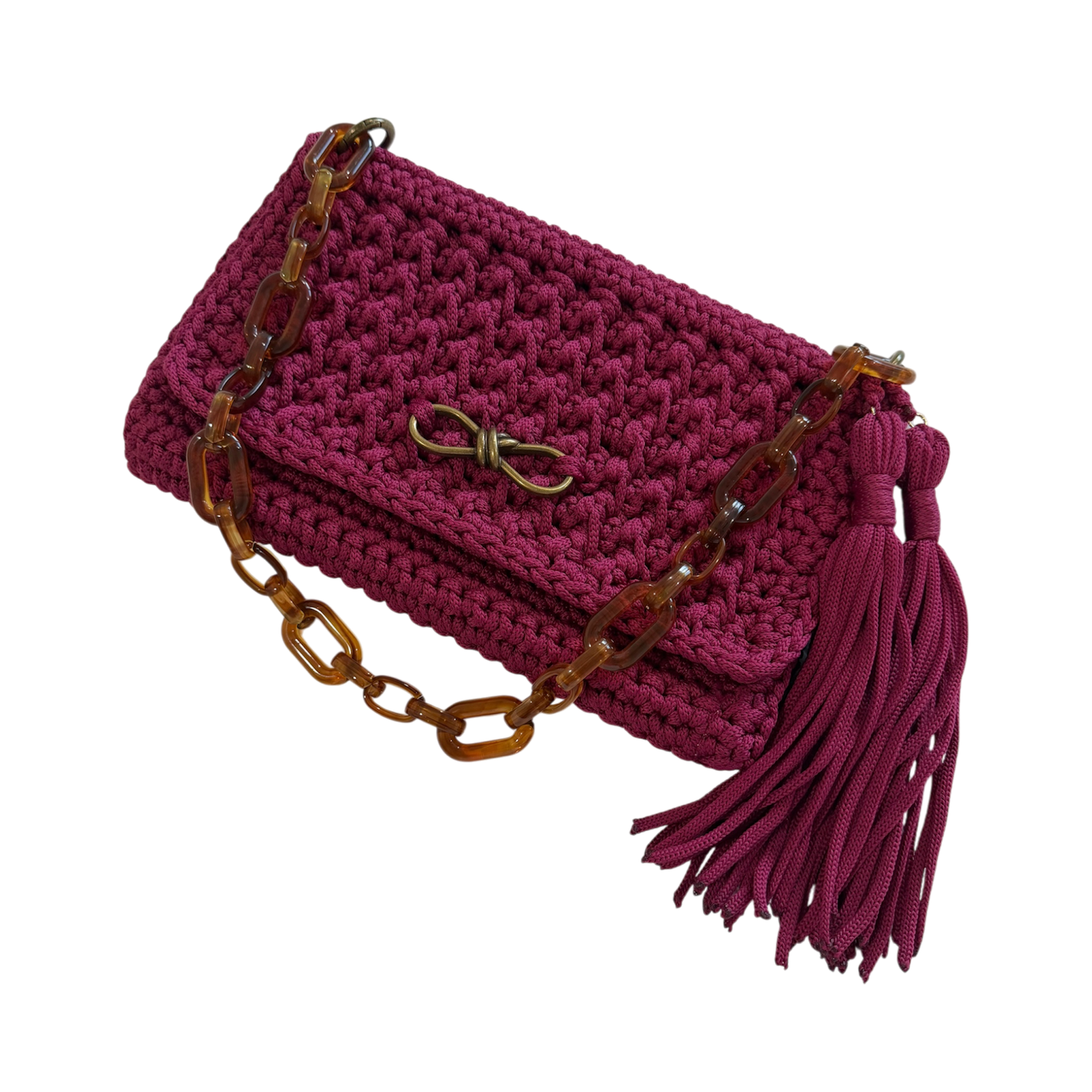 Polly Clutch Mulberry Reserve showcasing the resin chain, bronze hardware, decorative front accent, and textured hand-crocheted finish