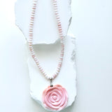 Limited-edition conch shell necklace with blush and ivory conch rondelles, hand-carved conch shell rose pendant, and silver detailing.