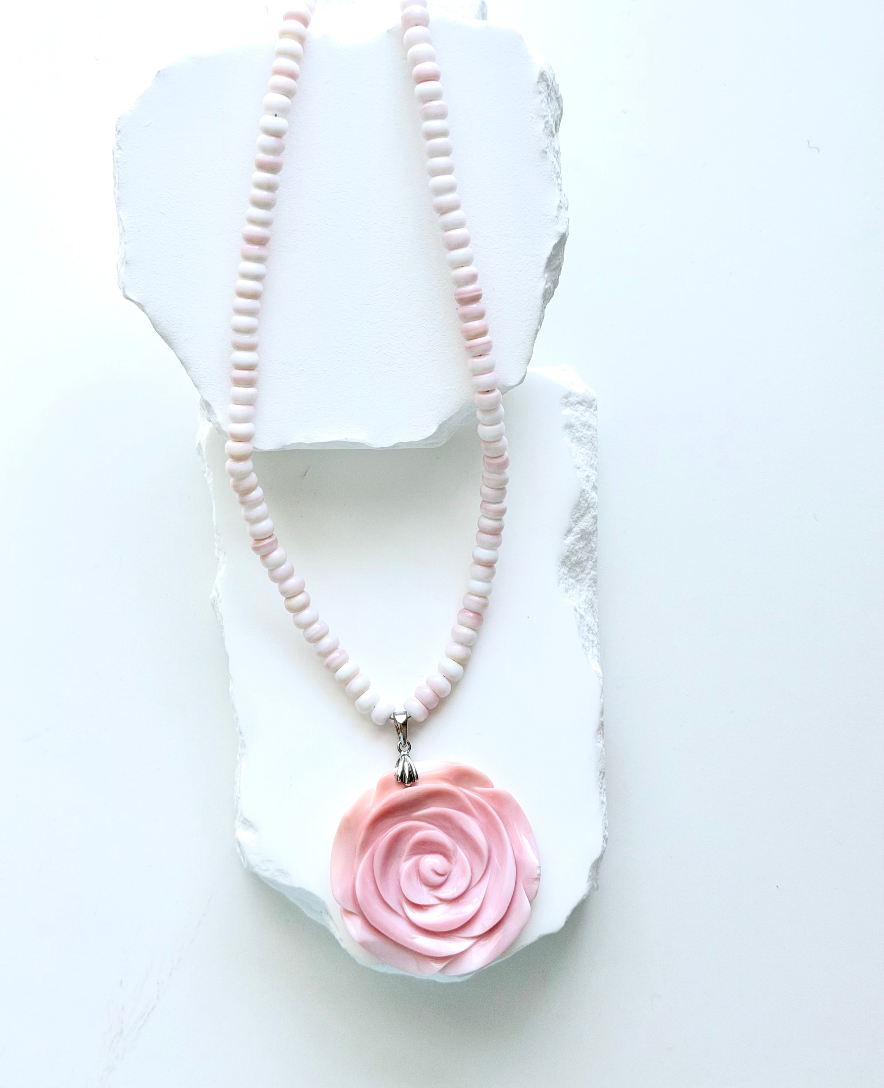 Limited-edition conch shell necklace with blush and ivory conch rondelles, hand-carved conch shell rose pendant, and silver detailing.