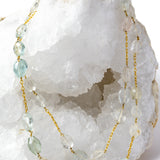 Serenity Mist necklace styled as an elegant two-strand silhouette, showcasing natural faceted aquamarine gemstones and a gold-plated chain with versatile styling.