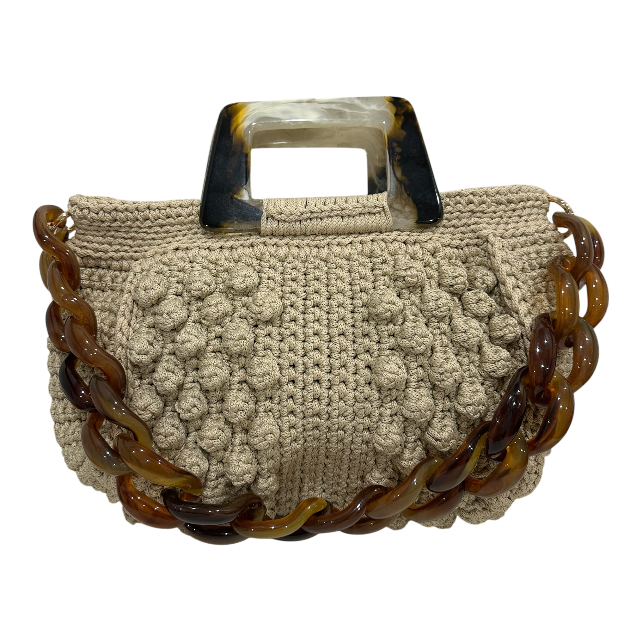 Hand-crocheted Paloma handbag in a soft stone-toned neutral with dimensional textured stitching, featuring a sculptural resin top handle and a coordinating chain strap.