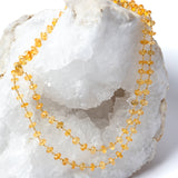Sunkissed natural citrine necklace styled as a shorter double strand, showcasing its versatile 36-inch length and luminous golden gemstones.