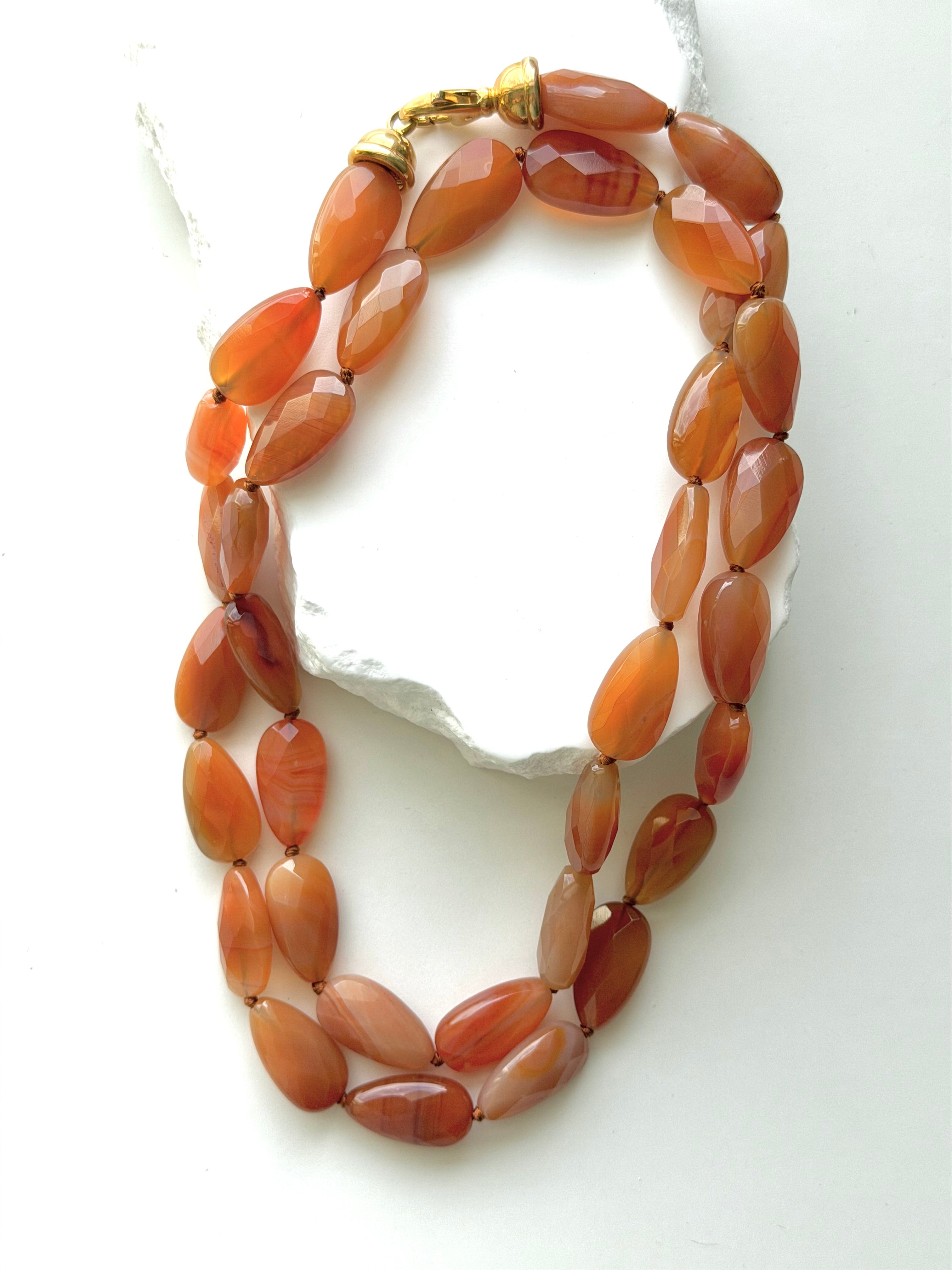 Terracotta Glow milky carnelian necklace styled as a shorter double strand, showcasing its softly opaque faceted gemstones and warm natural color variations.