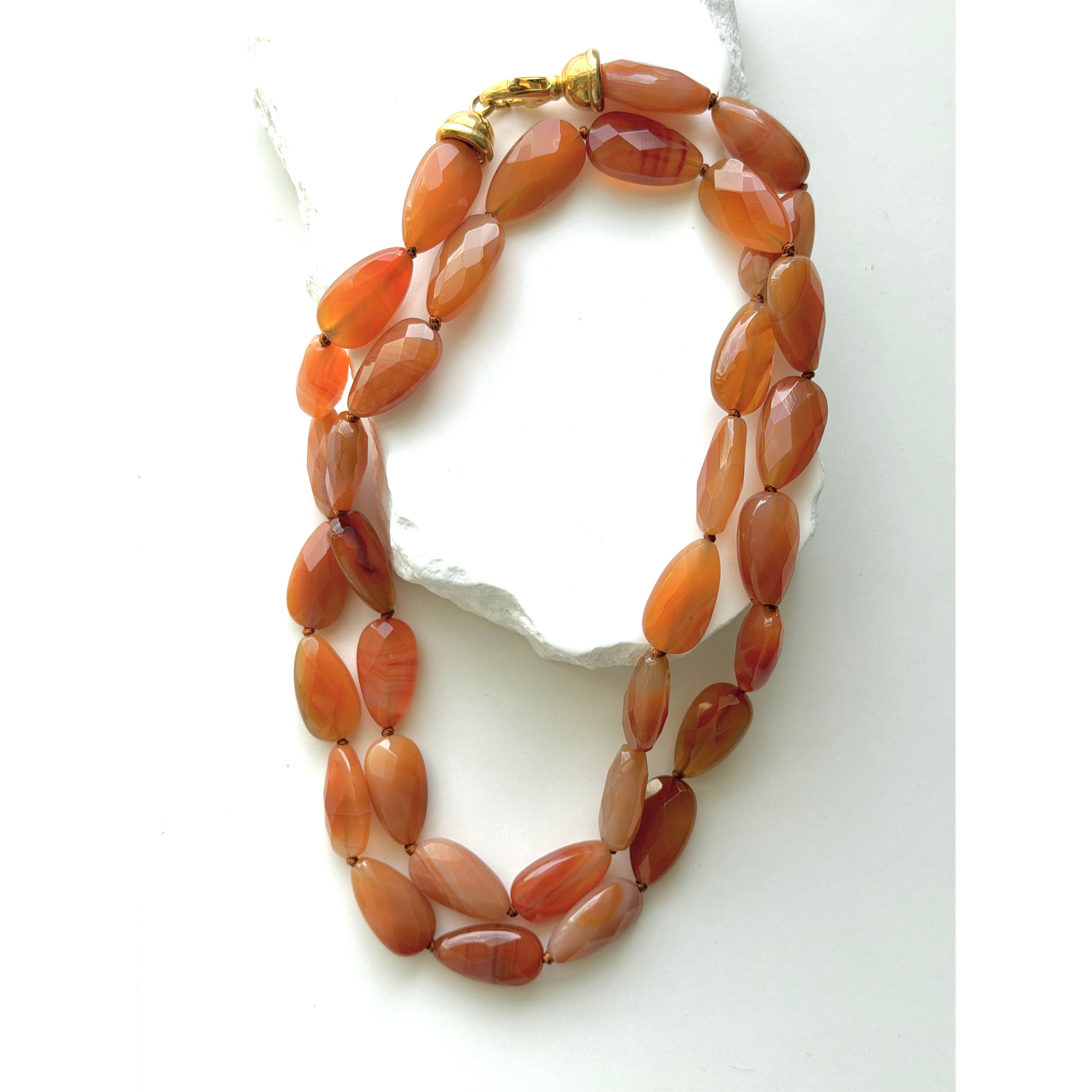 Terracotta Glow milky carnelian necklace styled as a shorter double strand, showcasing its softly opaque faceted gemstones and warm natural color variations.