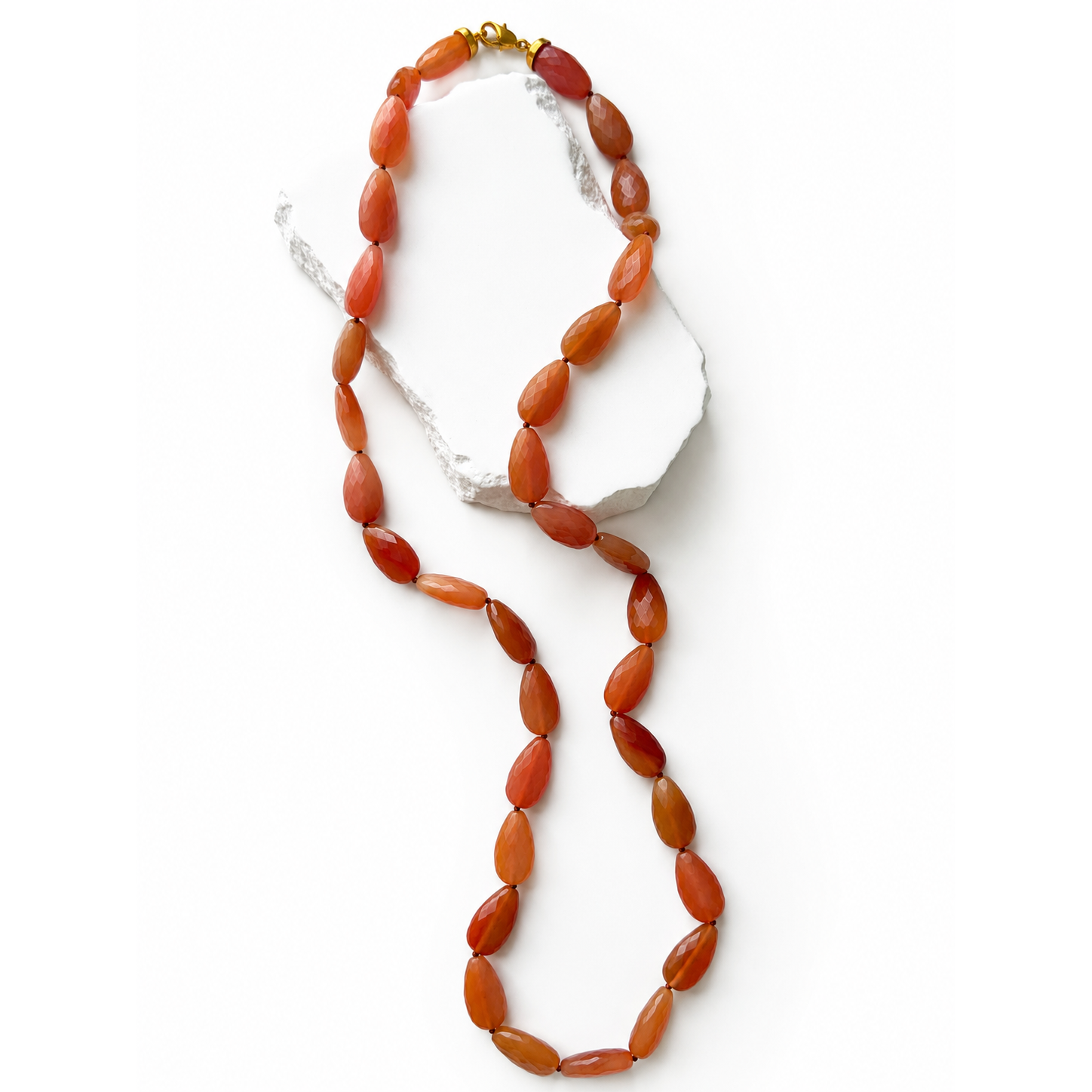 Terracotta Glow 34-inch natural milky carnelian necklace featuring faceted round gemstones in rich terracotta, burnt orange, caramel, and deep reddish tones.