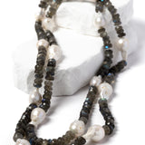 Twilight labradorite and baroque pearl necklace styled as a shorter two-strand necklace, showcasing the contrast of smoky faceted gemstones and luminous pearls.