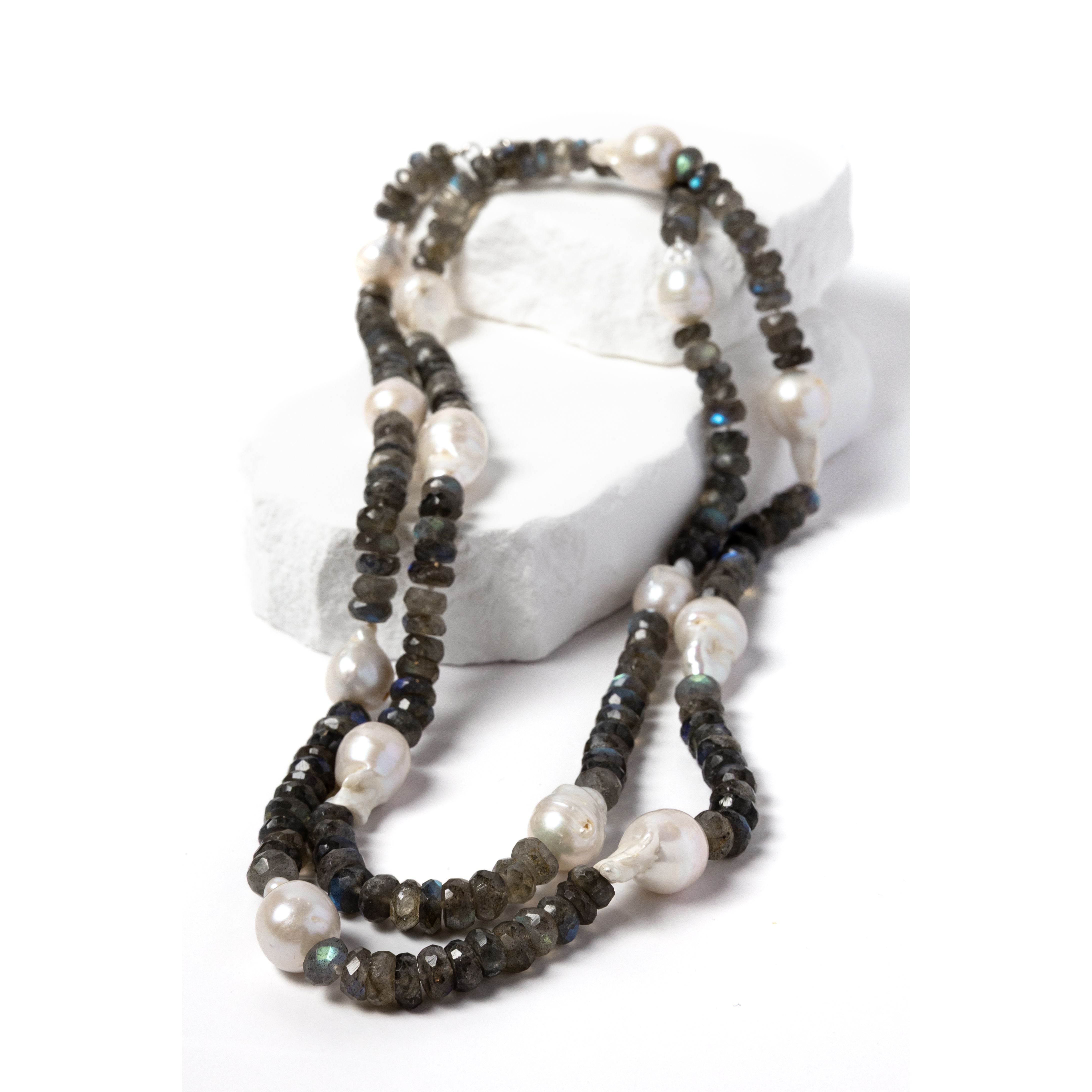 Twilight labradorite and baroque pearl necklace styled as a shorter two-strand necklace, showcasing the contrast of smoky faceted gemstones and luminous pearls.