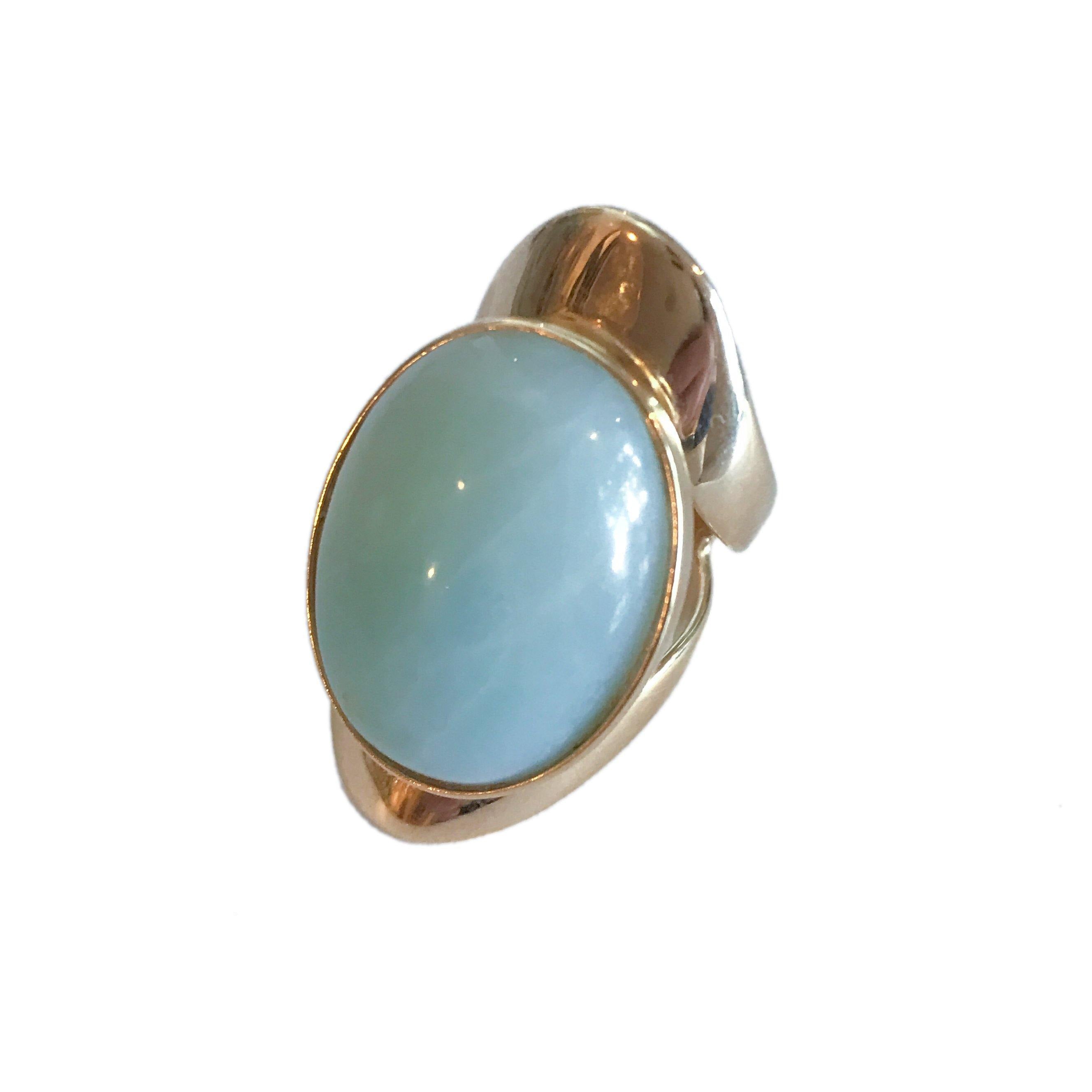 Allure statement ring featuring a natural 25 × 18 mm amazonite cabochon with soft seafoam and tranquil blue-green hues in a sculptural gold-plated setting, ergonomically designed for exceptional comfort.